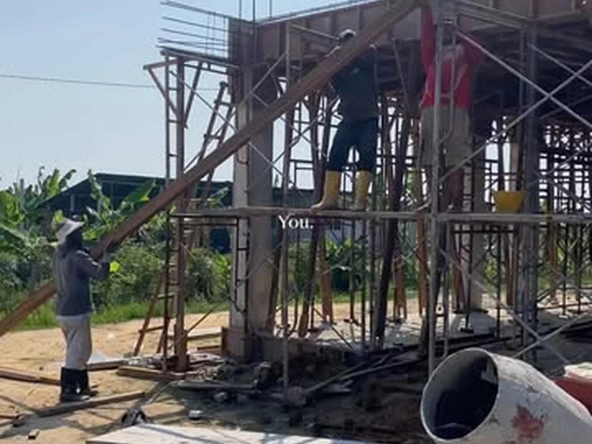 Construction team working on a structural frame
